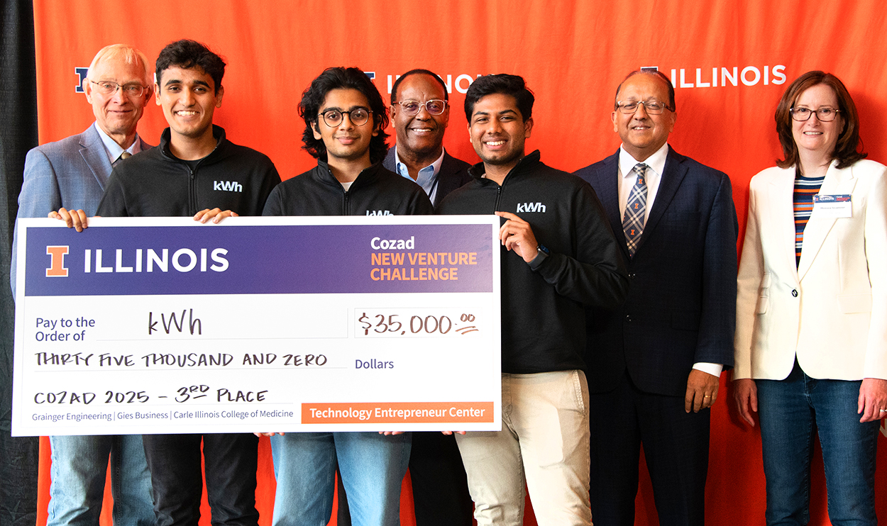 kWh accepts the Third Place prize.