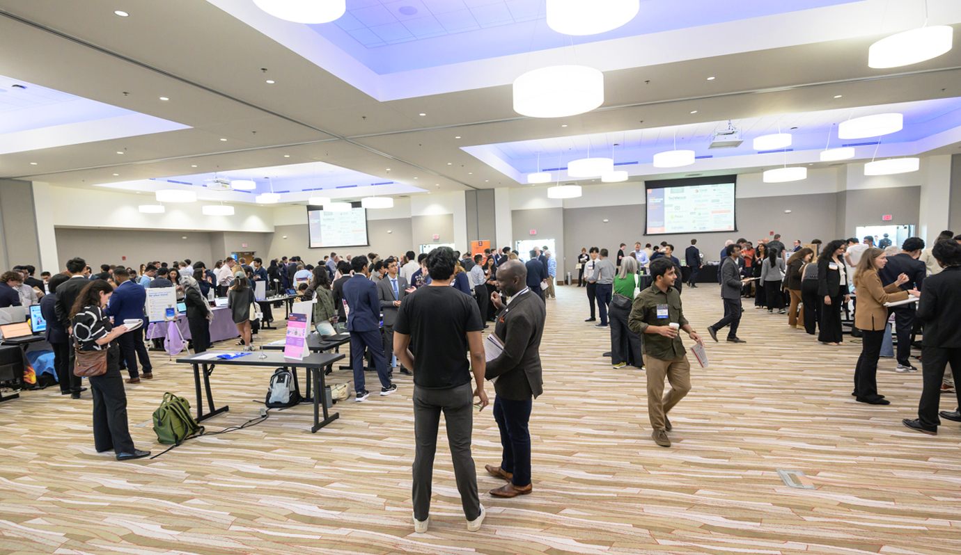 Room full of startup teams showcasing their startup idea. 